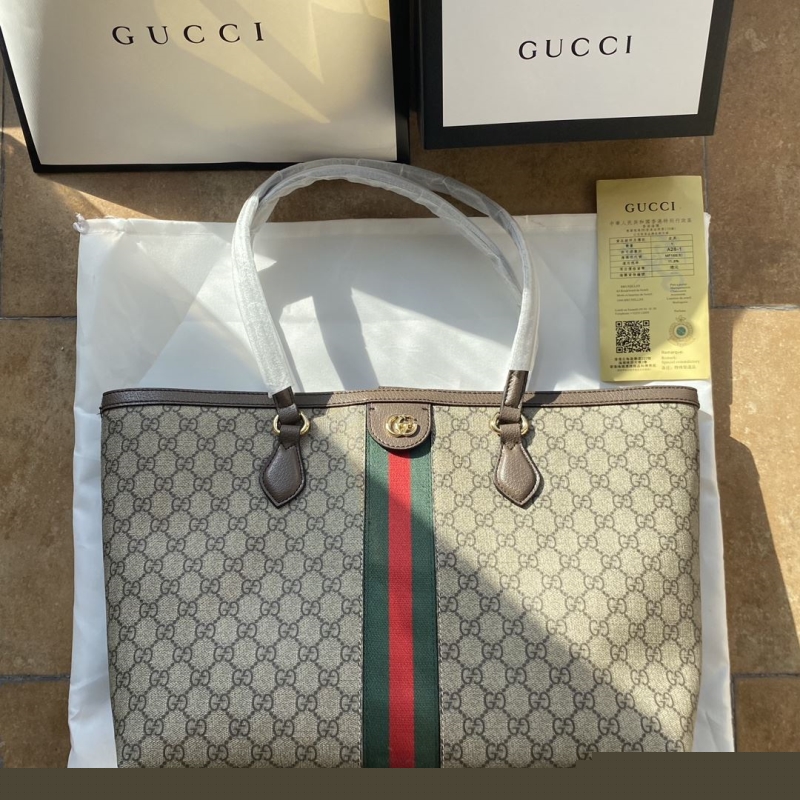G*u*i shopping bags